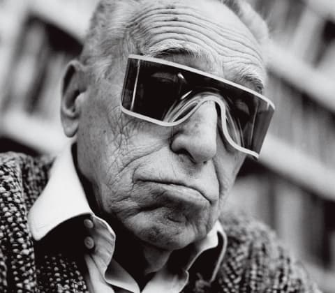 An off-kilter portrait of Achille Castiglioni with sunglasses
